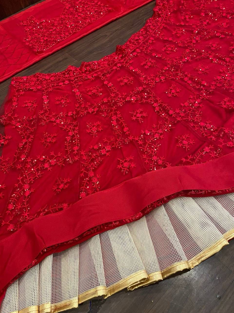 Red color Butterfly net embroidery sequence work with can can lehenga choli