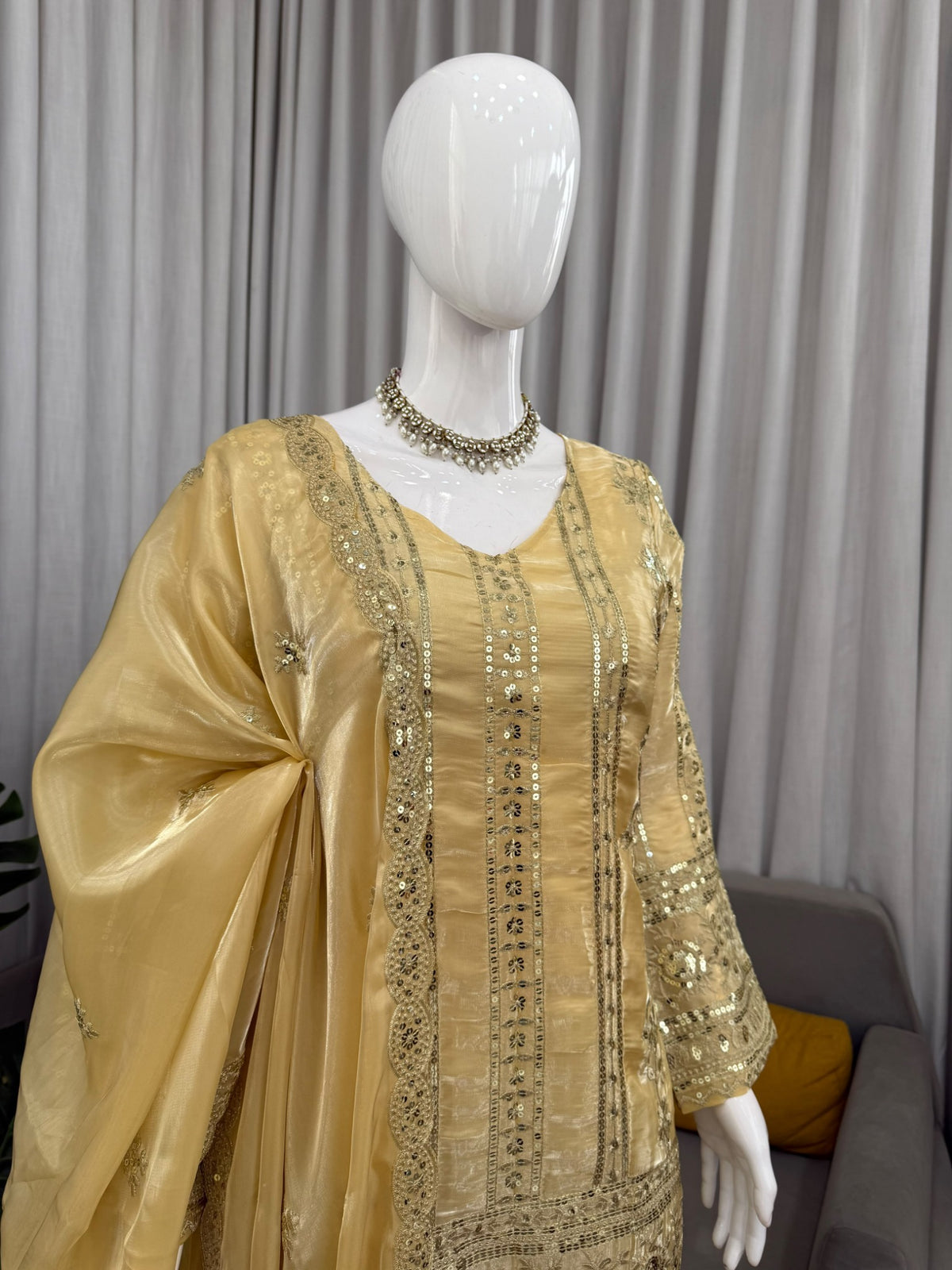 Close-up of golden yellow palazzo set embroidery, neckline and dupatta