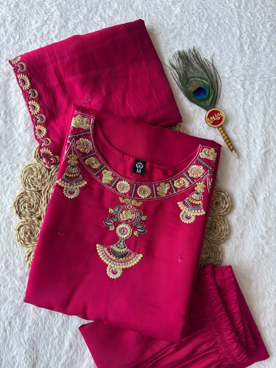 Model wearing pink embroidered kurta set reference photo 6