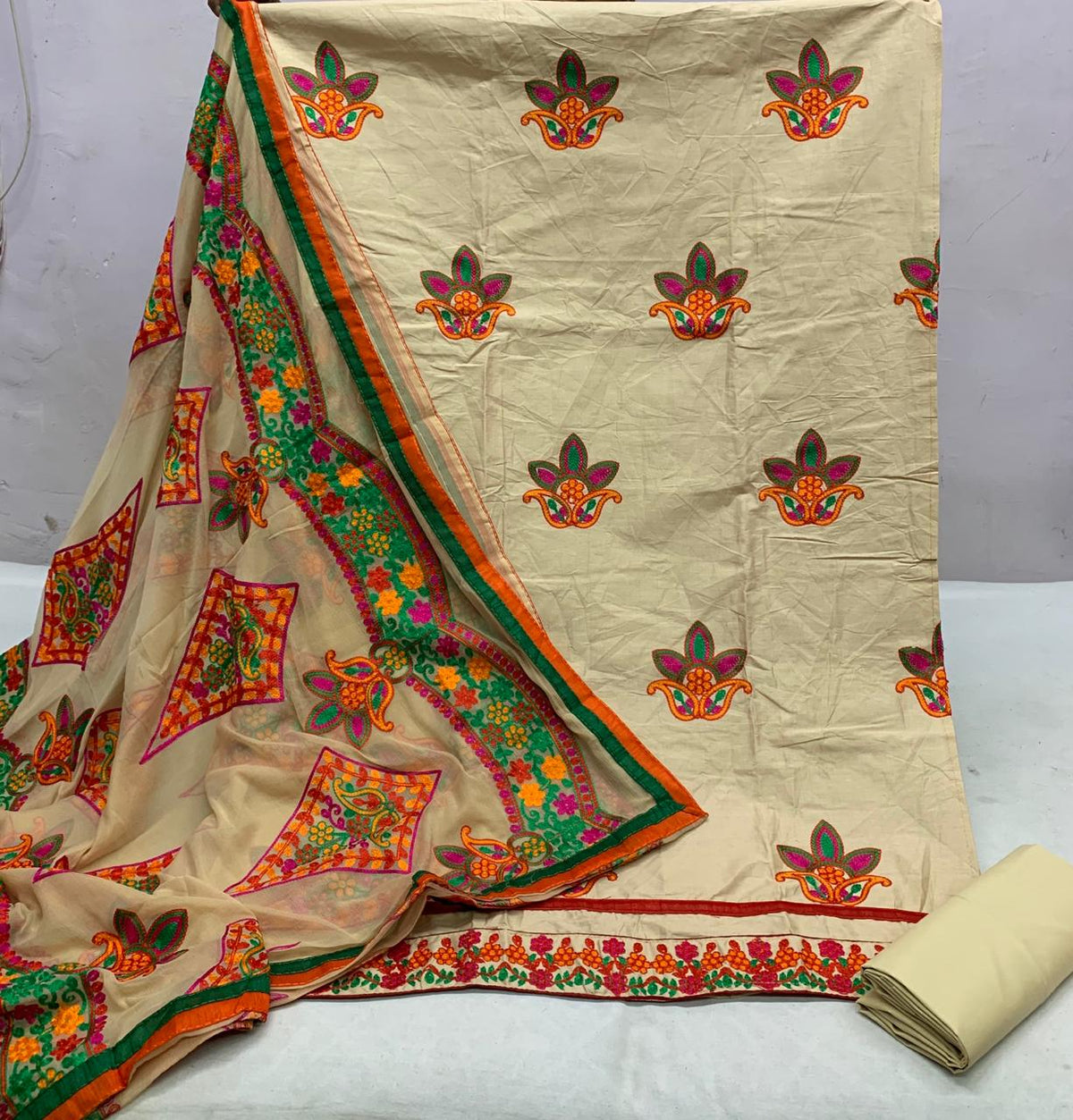 Comely Cream Color Jaam Cotton Satin Embroidered Aari Lace Work Salwar Suit