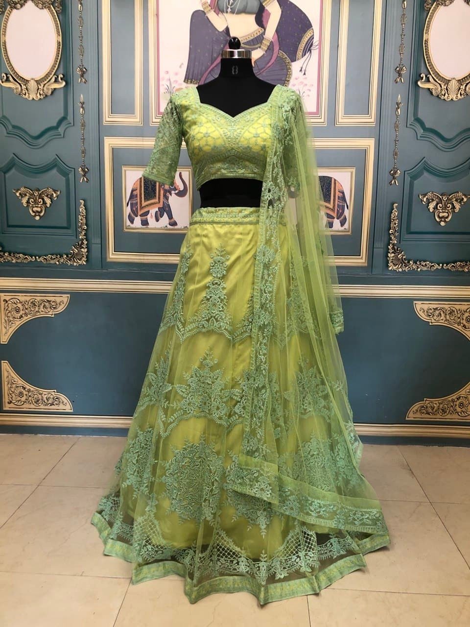 Thrilling Green Color Thread Embroidered Work Nylon Net Lehenga Choli For Women