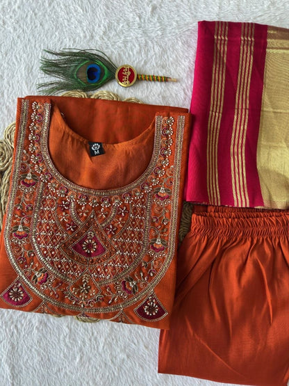 Rust kurta set with matching pants and embroidered neckline