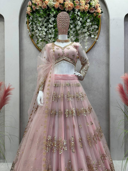 Latest Peach Color Butterfly Net Sequence Work Wedding Wear Lehenga Choli