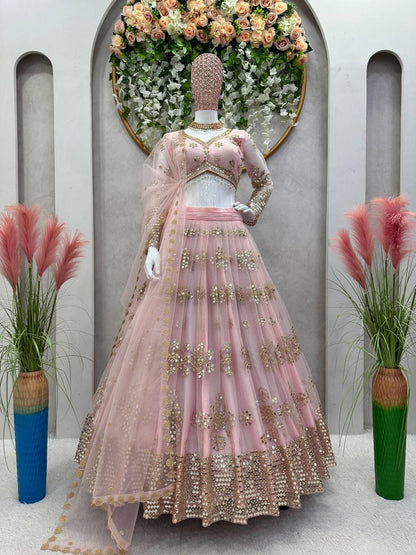 Latest Peach Color Butterfly Net Sequence Work Wedding Wear Lehenga Choli