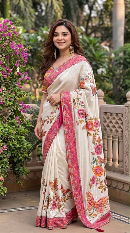 Model wearing ivory printed mirror-work saree