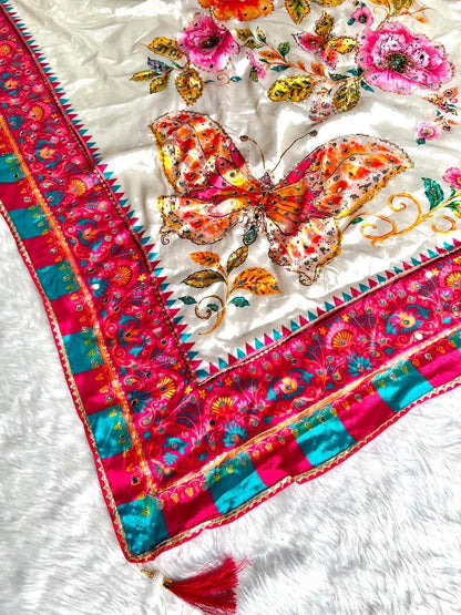 Close-up of butterfly mirror work on saree