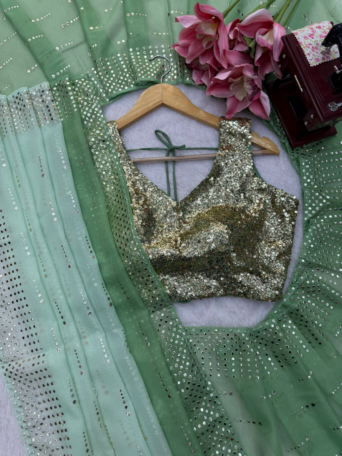 Foil work details on sage green designer saree