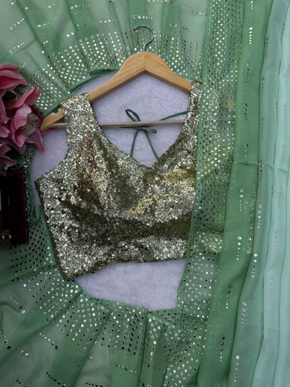 Sequins work blouse paired with sage green saree