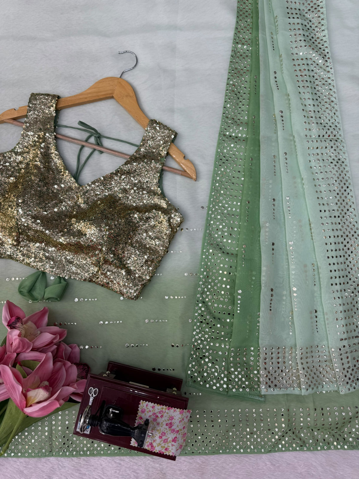 Saree border and blouse detail in sage green