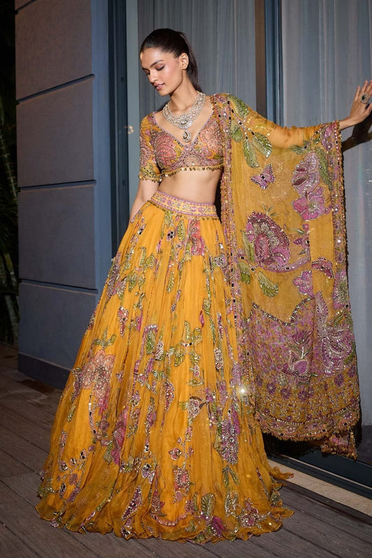 Mustard yellow floral printed Taby silk lehenga set with embellished blouse and dupatta - front model view