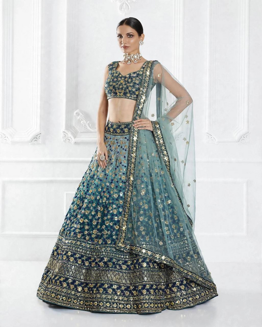 Teal blue embroidered chinon silk lehenga choli with floral sequins and butterfly net dupatta