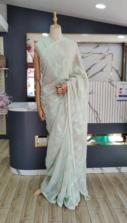 Latest awesome party wear light color georgette saree with blouse