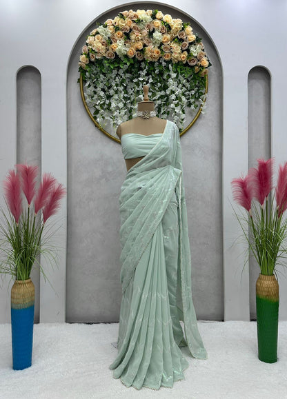 Latest awesome party wear light color georgette saree with blouse