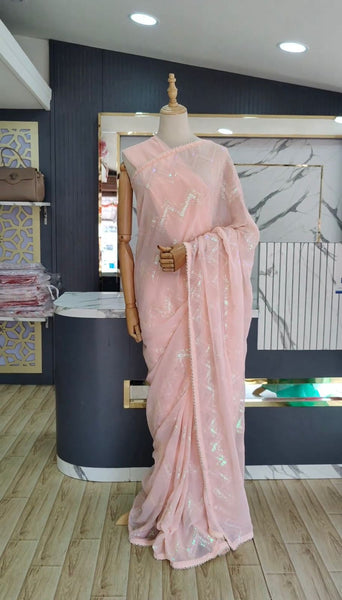 Latest awesome party wear light color georgette saree with blouse