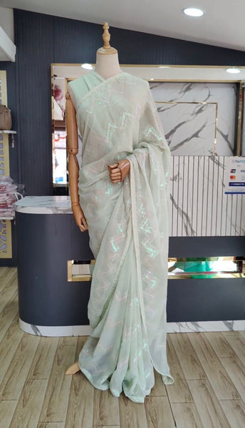 Latest awesome party wear light color georgette saree with blouse