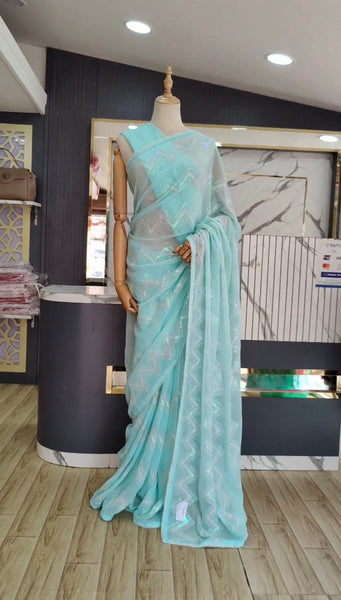 Latest awesome party wear light color georgette saree with blouse