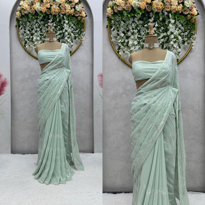 Latest awesome party wear light color georgette saree with blouse