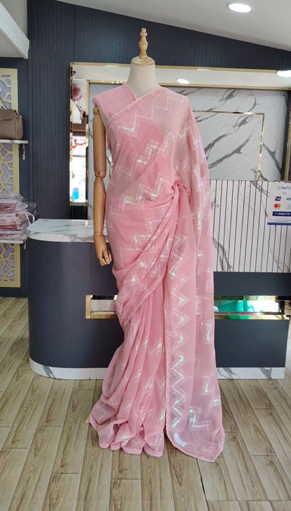 Latest awesome party wear light color georgette saree with blouse
