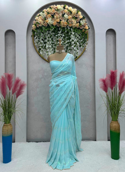 Latest awesome party wear light color georgette saree with blouse