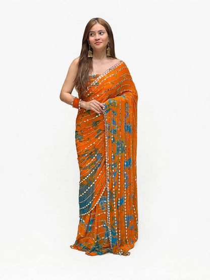 Green saree fabric and mirror work detail