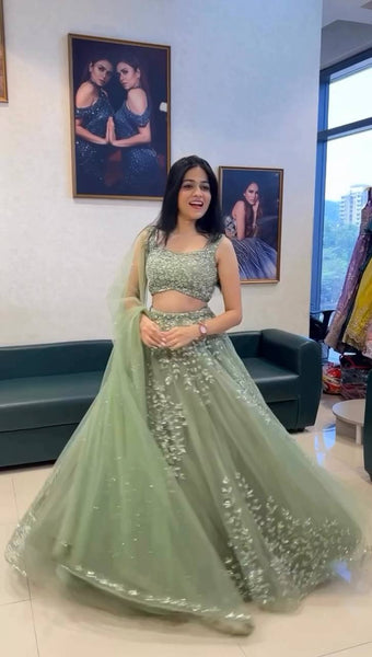 Exquisite Soft Butterfly Net Pista color Lehenga Choli with Sequence Coding Work