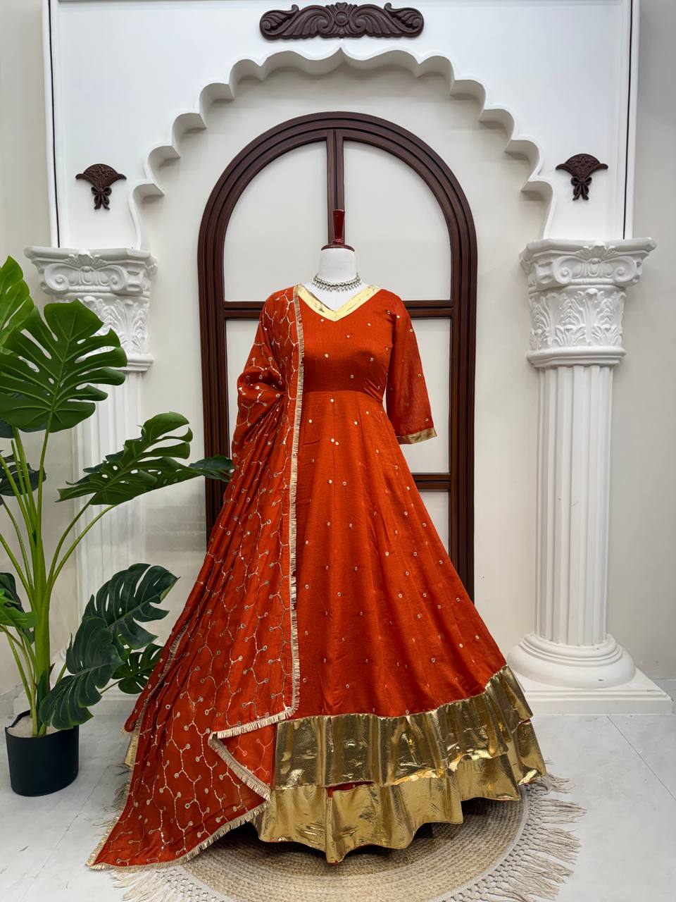 Full-length rust orange Anarkali lehenga set