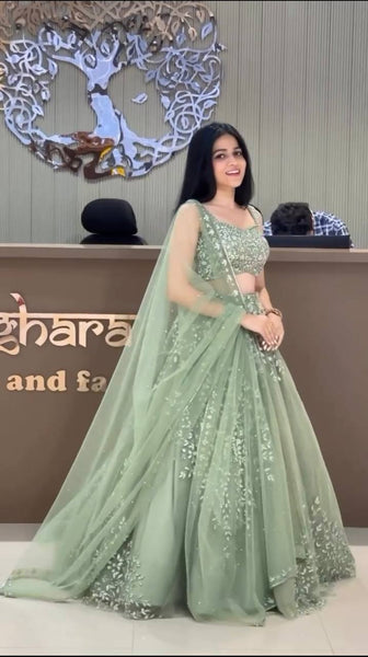 Exquisite Soft Butterfly Net Pista color Lehenga Choli with Sequence Coding Work