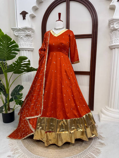 Rust orange Anarkali set with gold hem and dupatta