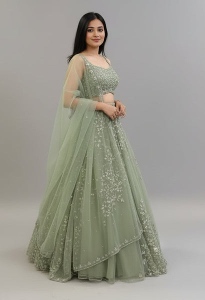 Exquisite Soft Butterfly Net Pista color Lehenga Choli with Sequence Coding Work