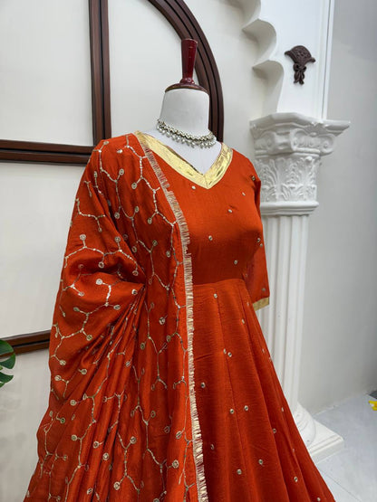 Close-up of rust orange Anarkali neckline and dupatta work