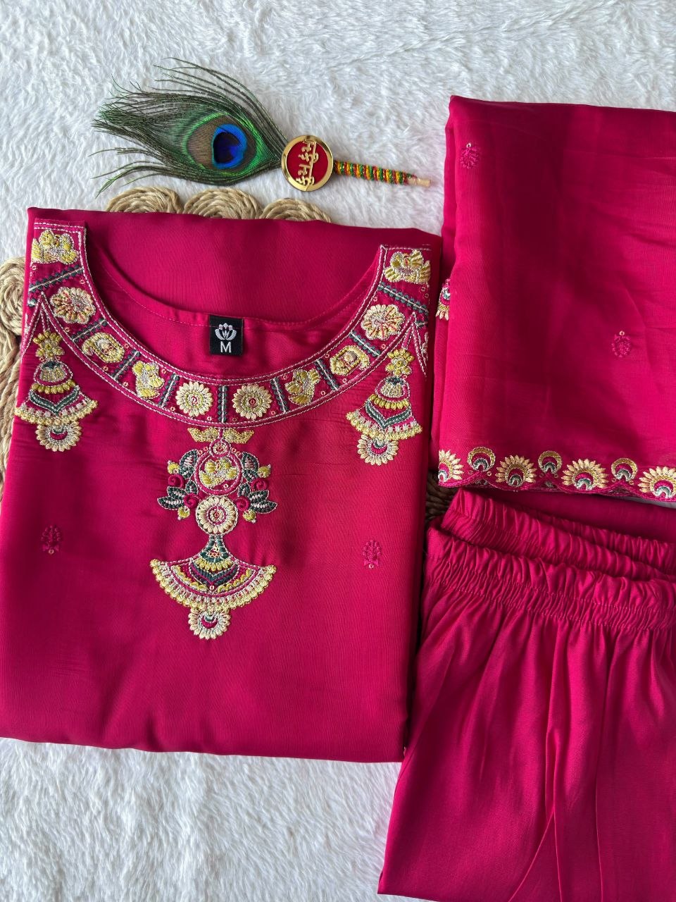 Pink embroidered kurta set neckline and fabric detail