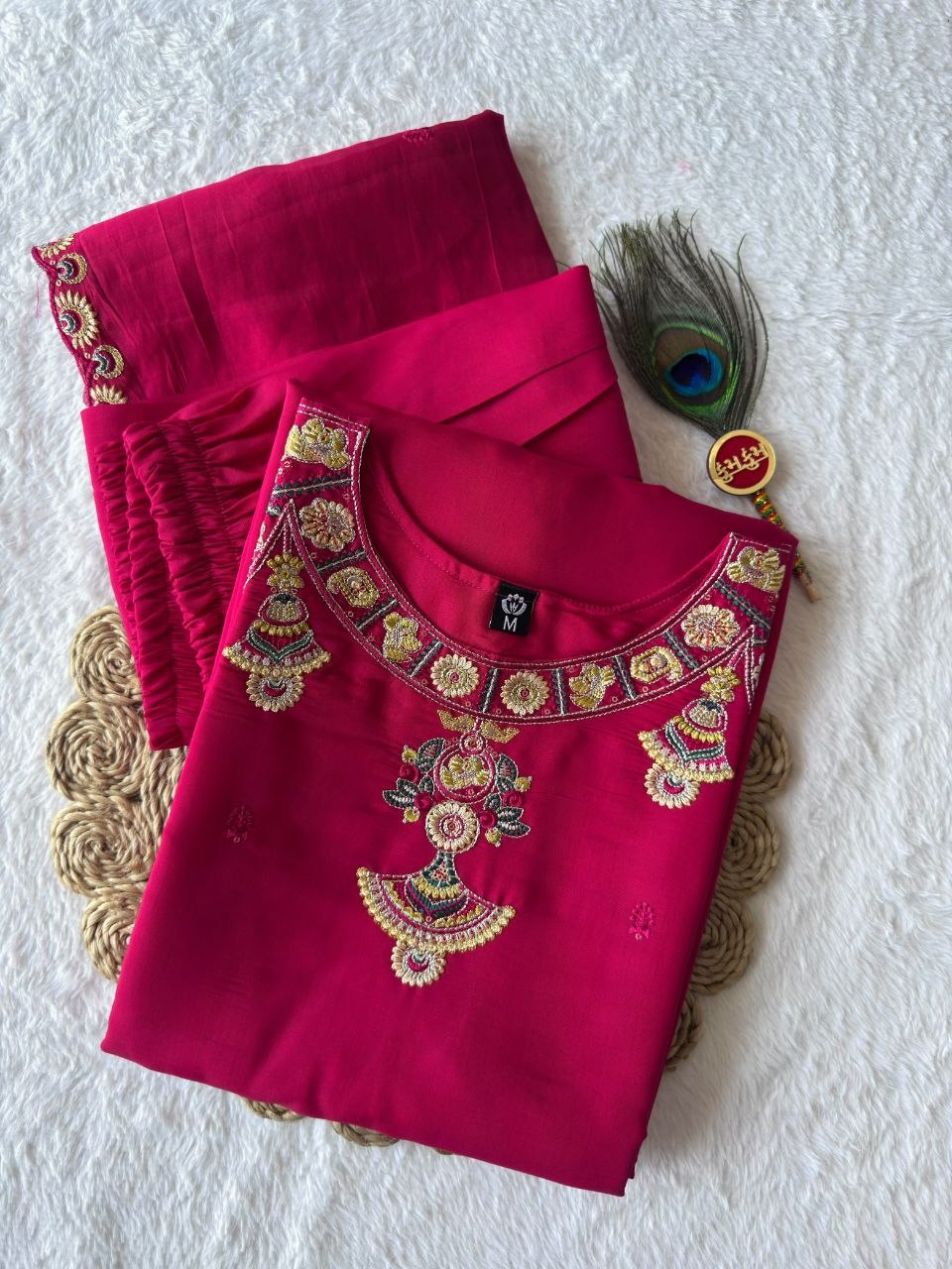 Pink embroidered kurta pant set folded product photo