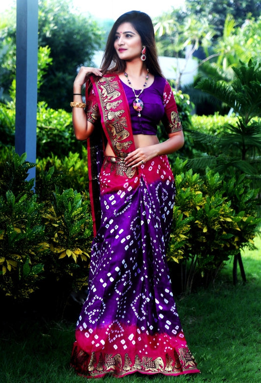 Breathtaking Rani & Purple Silk Bandhej With Zari Weaving Border Saree for Party Wear