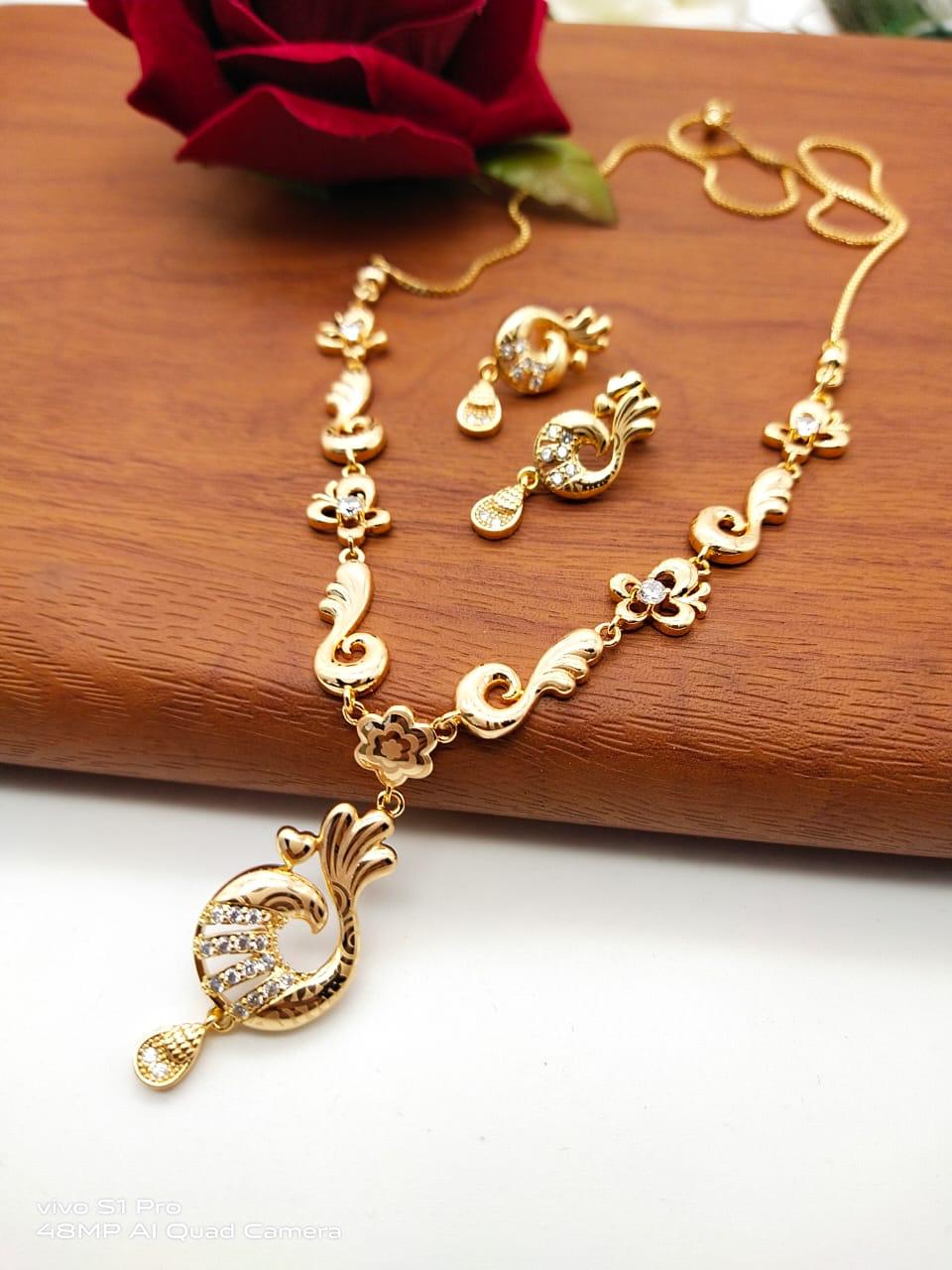 Mind-Boggling White Diamond Golden Imitation Necklace Set Design