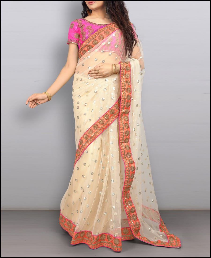 Pulchritudinous Cream Net Thread Embroidered Diamond Work Saree Blouse