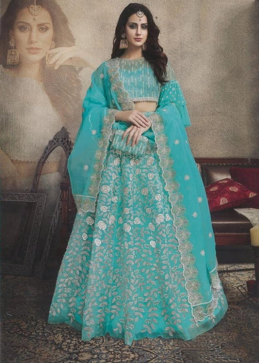 Breath-taking Firozi Color Festive Wear Bridal Butterfly Net Stone Embroidered Work Designer Lehenga Choli