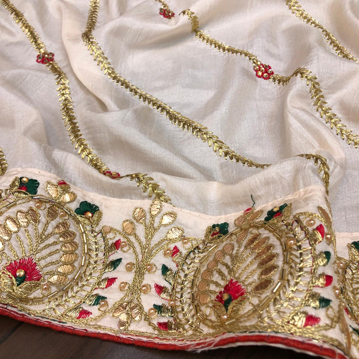 Impressive Light Peach Color Designer Thread Zari Embroidered Gotta Patti Stone Work Dola Silk Saree Blouse For Wedding Wear