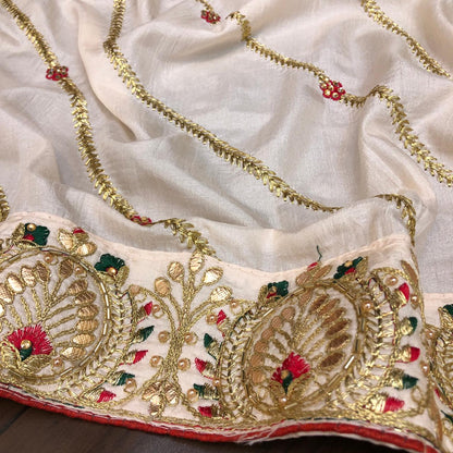 Impressive Light Peach Color Designer Thread Zari Embroidered Gotta Patti Stone Work Dola Silk Saree Blouse For Wedding Wear