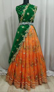 Bewildering Orange Color Dashing Organza Design Embroidered Stone Cut Work Digital Printed Lehenga Choli
