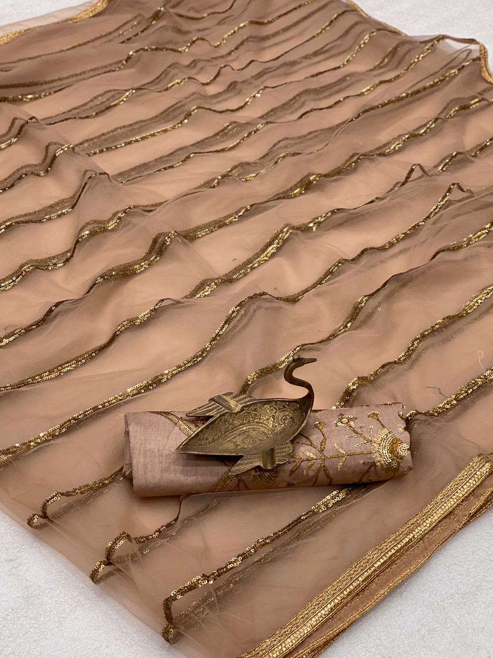 Eye-catching Beige Color Festival Wear All Over Sequence Embroidered Leheriya Work Design Mono Net Saree Blouse