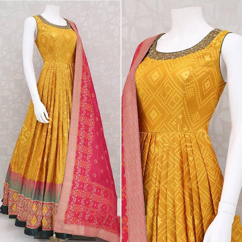 Astonishing Mustard Color Festive Wear Soft Butter Crape Silk Patola Printed Designer Full Stitched Gown
