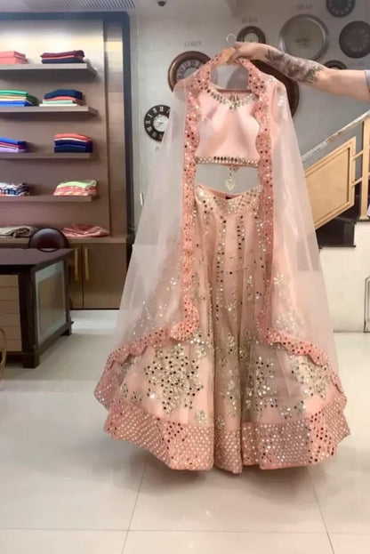 Flaunt Peach Color Function Wear Net Mirror Work Lehenga Choli
