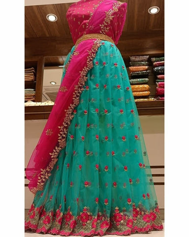 Shattering Firozi Color Occasion Wear Organza Stone Cut Work Lehenga Choli