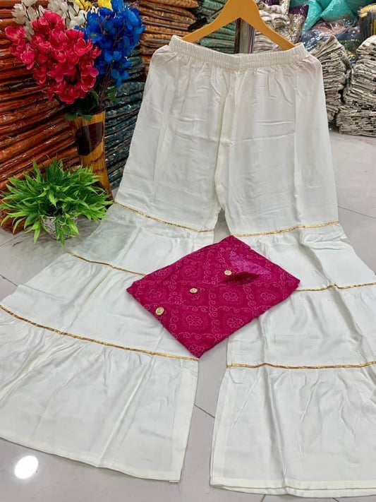 Surpassing Pink Color Rayon Ready Made Bandhani Printed Plazo Kurti