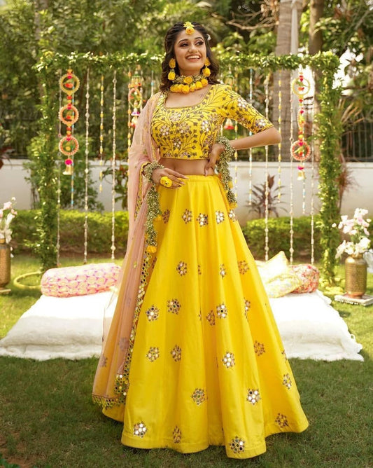 Staggering Yellow Color Function Wear Taffeta Silk Mirror Work Lehenga Choli