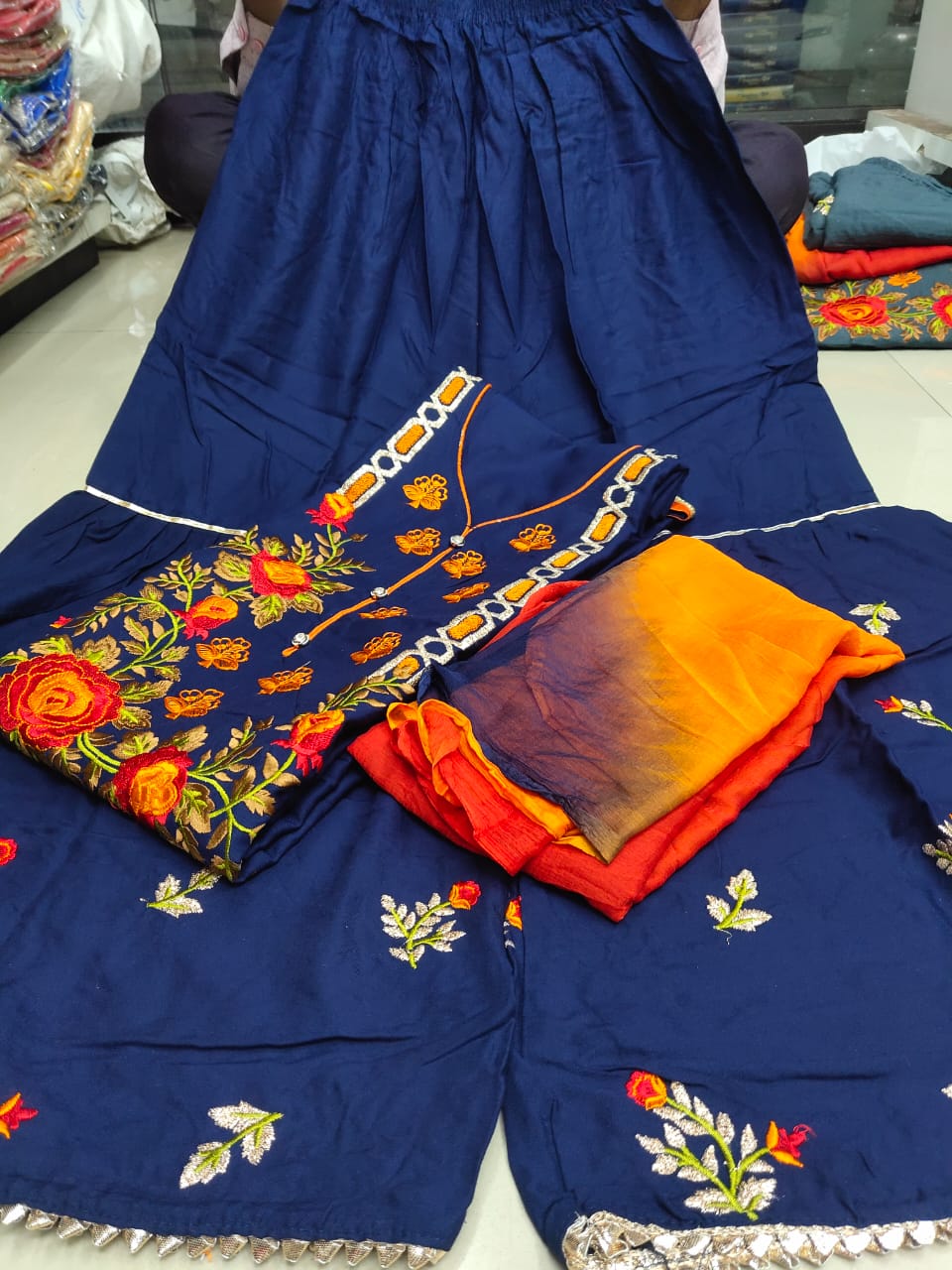 Engrossing Blue Rayon With Heavy Embroidered Work Kurti Plazo For Women
