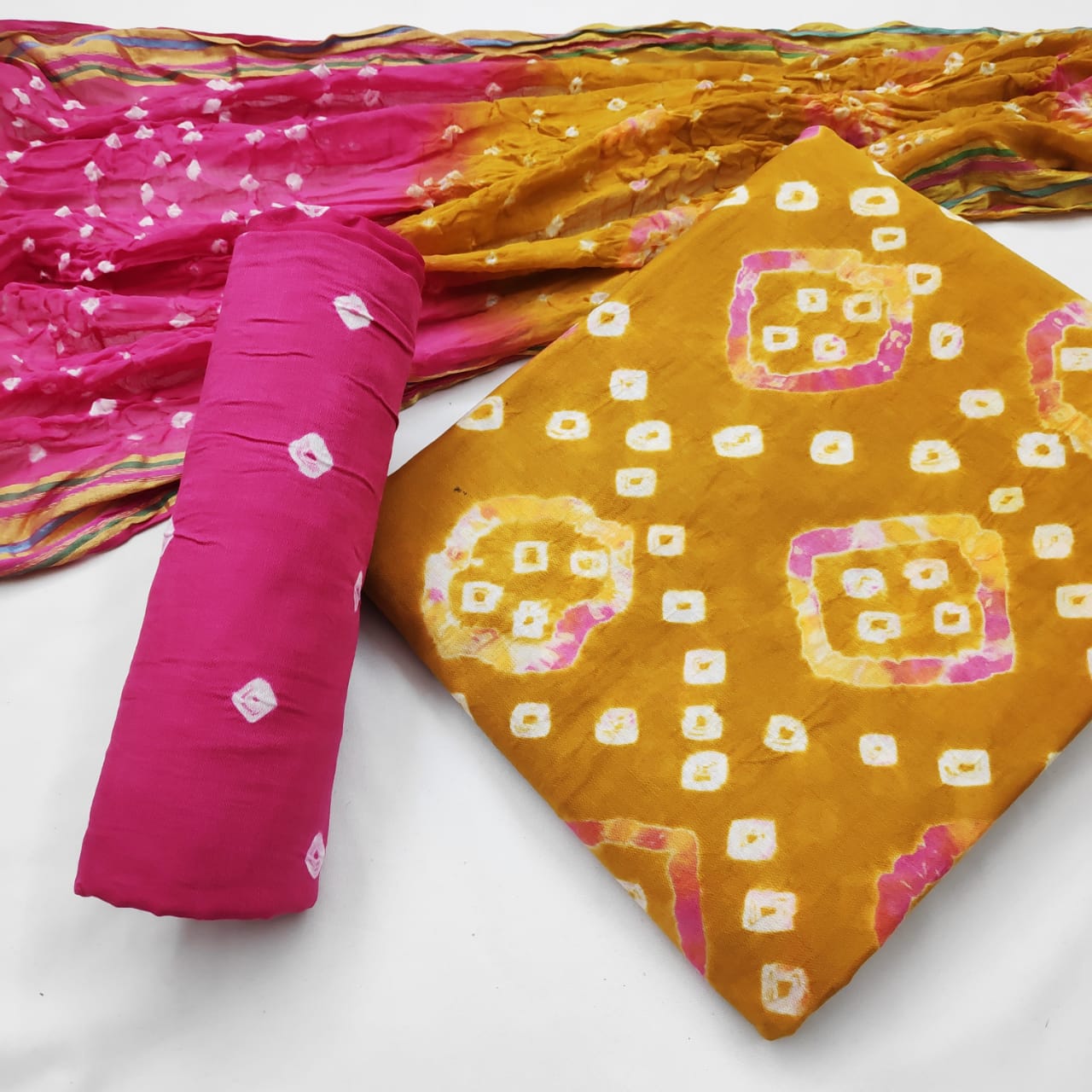 Pretty Amber Color Cotton Bandhej Hand Dying Salwar Suit For Festive Wear